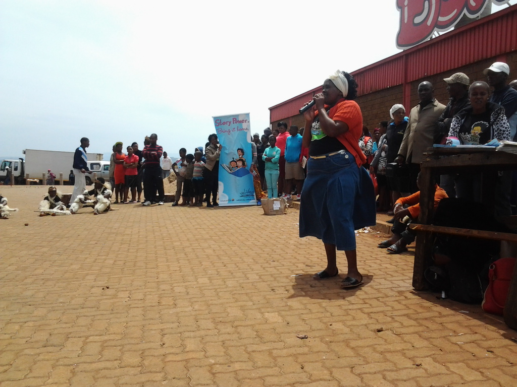 7. mrs Mthenjana telling a story to the crowds1