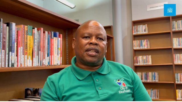 Meet a librarian who followed the call of books

In this video, Dondo Dithebe, Library Assistant at Thembisa West Library in Thembisa, shares how his journey into librarianship began.

It all started with a simple adventure. As a learner, his teacher encouraged the class to go out and find a library nearby. That moment sparked a lifelong connection with books and reading, eventually leading him to become a librarian.

Today, he continues to inspire communities and young readers through the power of stories and access to books. 

Watch the video below to hear more about his story.

#SALibraryWeek #LibrariesTransform #ReadingForJoy #Nalibali #LiteracyForAll